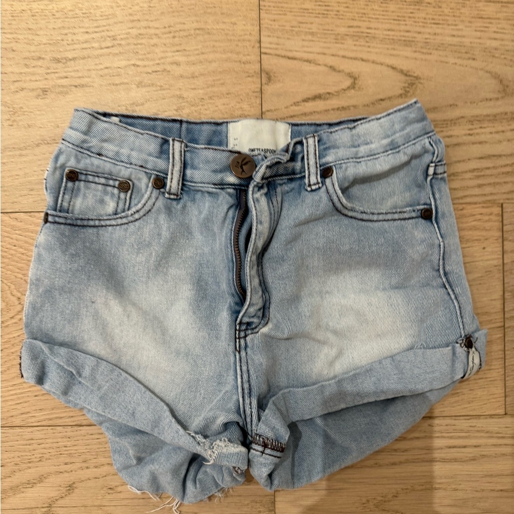 These are light blue kids One Teaspoon jean shorts.